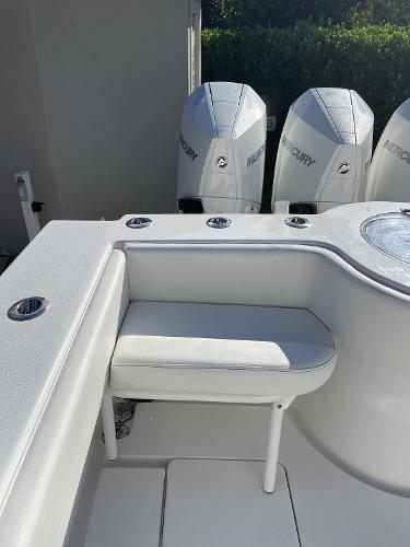 Slide: The Image of 2021 Onslow Bay 41 Tournament Edition boat with Mercury engines and cushioned seating. - 18
