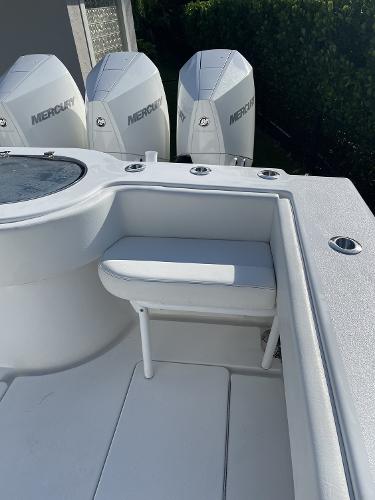Slide: The Image of 2021 Onslow Bay 41 Tournament Edition boat with Mercury engines, featuring a sleek white deck. - 19