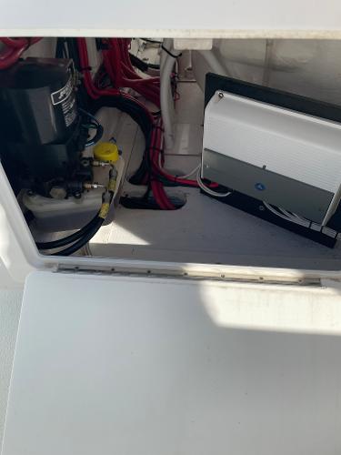 Slide: The Image of 2021 Onslow Bay 41 Tournament Edition boat interior wiring and equipment compartment. - 22