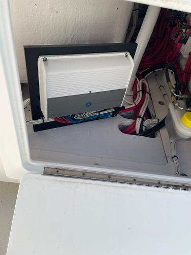 Slide: The Image of 2021 Onslow Bay 41 Tournament Edition electrical compartment with wiring and components. - 24