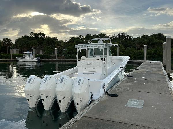 Slide: The Image of 2021 Onslow Bay 41 Tournament Edition boat docked with quad engines. - 4