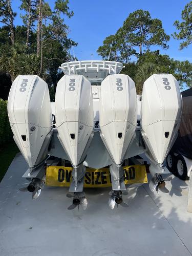 Slide: The Image of 2021 Onslow Bay 41 Tournament Edition boat with four powerful outboard motors, labeled "Oversize Load." - 7