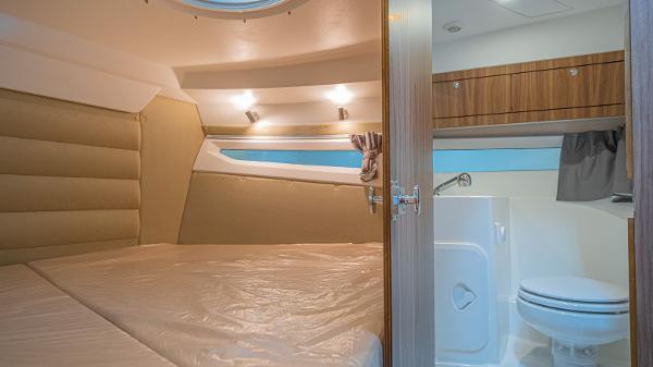 Slide: The Image of 2024 Parker Poland 920 Explorer Max cabin interior with bed and bathroom. - 9