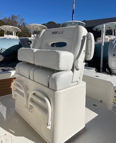 Slide: The Image of 2024 Pathfinder 2500 Hybrid boat with white cushioned seating. - 12