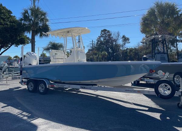 Slide: The Image of 2024 Pathfinder 2500 Hybrid boat on a trailer in a sunny outdoor setting. - 3