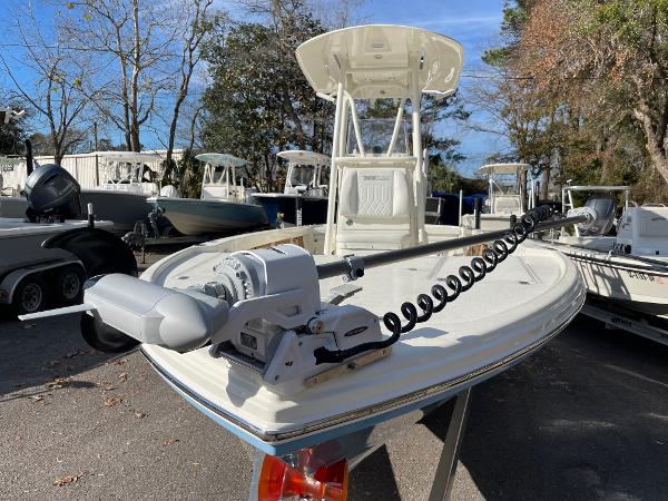 Slide: The Image of 2024 Pathfinder 2500 Hybrid boat with trolling motor in a marina. - 6