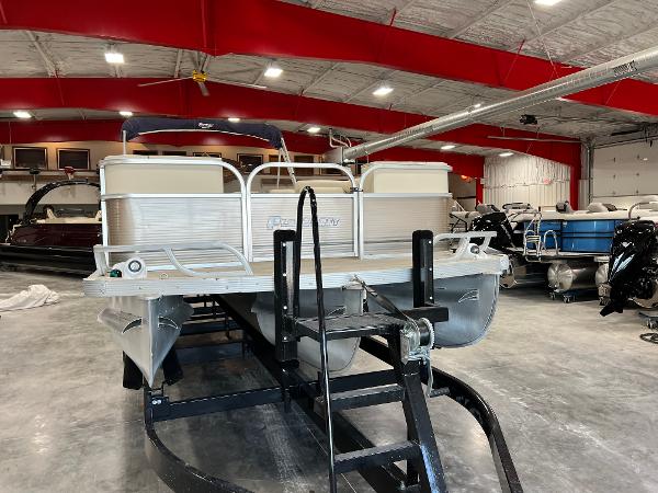 Slide: The Image of 2013 PlayCraft 2400 Clipper pontoon boat in indoor storage facility. - 4