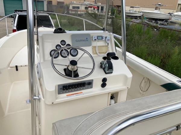 Slide: The Image of 1998 Pursuit 2270 Center Console boat dashboard with Garmin navigation system. - 1