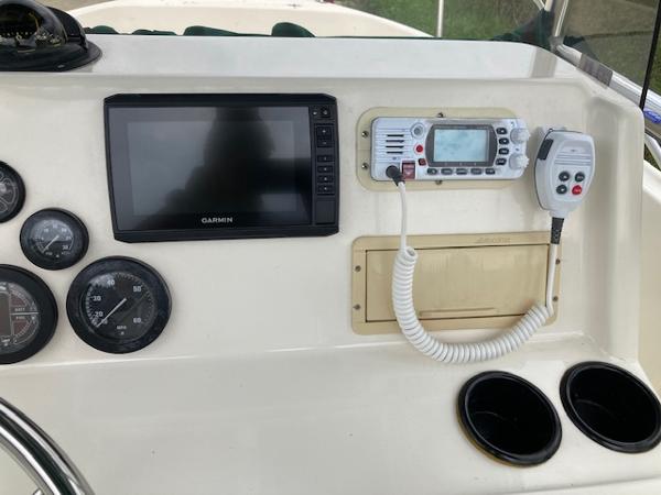 Slide: The Image of 1998 Pursuit 2270 Center Console dashboard with Garmin GPS and marine radio. - 2