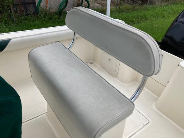 Slide: The Image of 1998 Pursuit 2270 Center Console boat seat with white upholstery. - 5