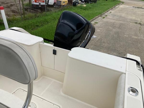 Slide: The Image of 1998 Pursuit 2270 Center Console boat with outboard motor, rear seating, and storage compartments. - 6
