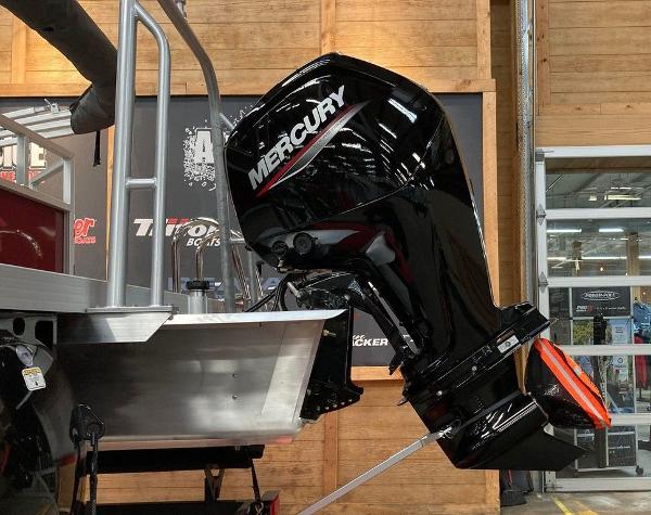 Slide: The Image of 2024 Ranger 200C boat with Mercury outboard motor in showroom. - 3