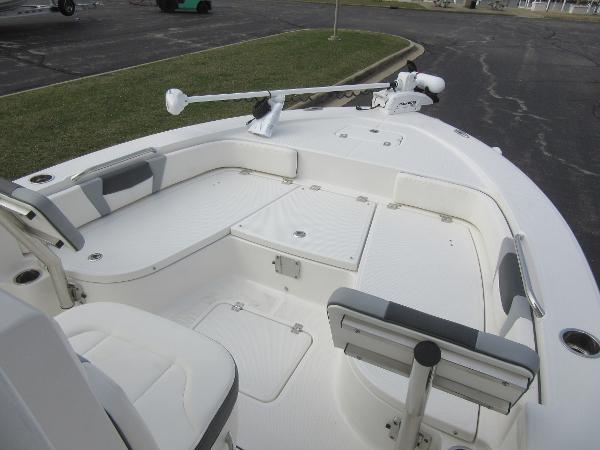Slide: The Image of 2024 Robalo 226 Cayman boat interior with seating and storage compartments. - 13