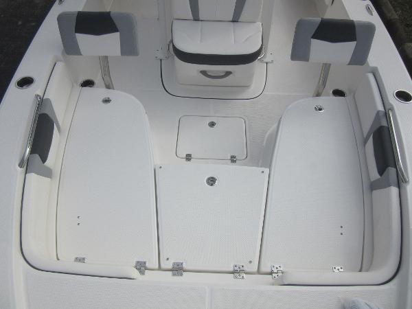 Slide: The Image of 2024 Robalo 226 Cayman boat interior with white and gray seating. - 15