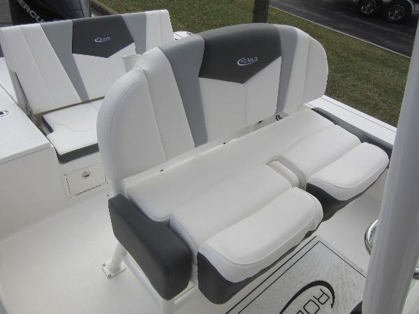 Slide: The Image of 2024 Robalo 226 Cayman boat seating with white and gray upholstery. - 9