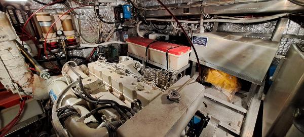 Slide: The Image of Engine room of a 1999 Rozema Boat Works Custom 42, showcasing machinery and components. - 25