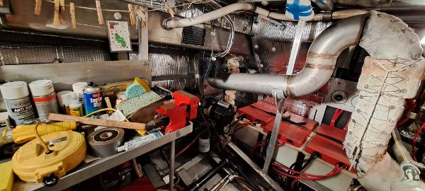 Slide: The Image of Engine room of a 1999 Rozema Boat Works Custom 42 with tools and equipment. - 26