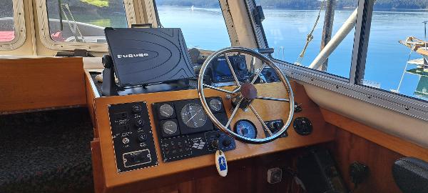Slide: The Image of 1999 Rozema Boat Works Custom 42 helm with Furuno navigation system. - 5