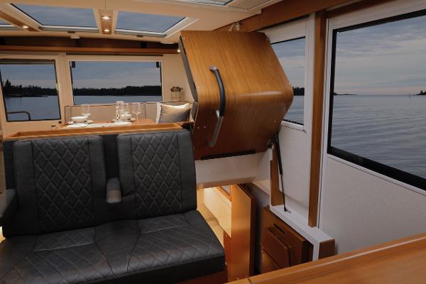 Slide: The Image of Luxurious interior of 2023 Sargo 45 boat with elegant seating and scenic window views. - 13