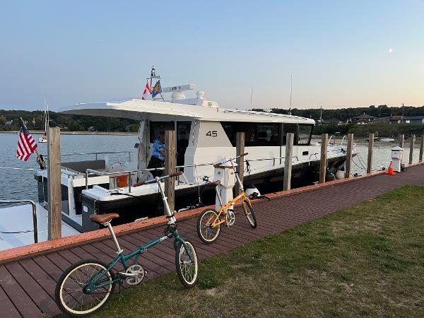 Slide: The Image of Sargo 45 yacht docked with two bicycles on the pier, 2023 model. - 23