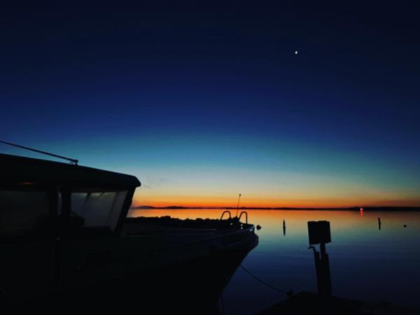 Slide: The Image of Sargo 45 boat at sunset on calm waters, 2023 model. - 29