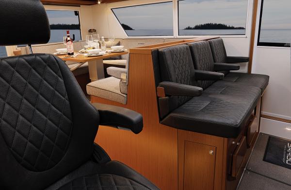 Slide: The Image of Luxurious interior of 2023 Sargo 45 boat with leather seating and dining area. - 3