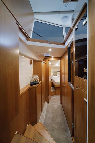 Slide: The Image of Interior of 2023 Sargo 45 yacht, featuring modern wood paneling and cozy cabin space. - 6