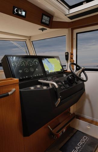 Slide: The Image of 2023 Sargo 45 boat cockpit with modern navigation system and steering wheel. - 7