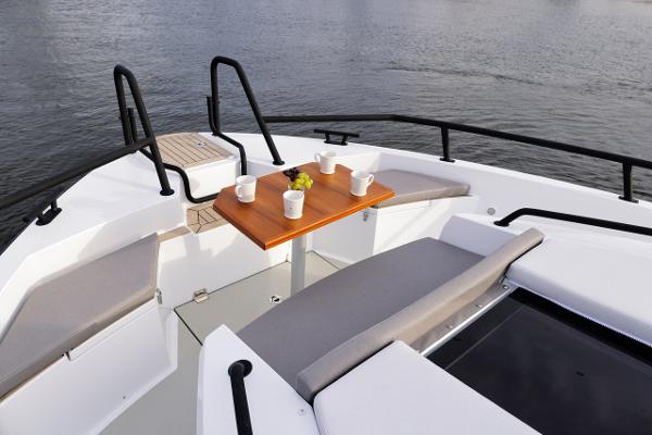 Slide: The Image of Sargo 45 Cat A 2025 boat deck with seating and table on calm water. - 11