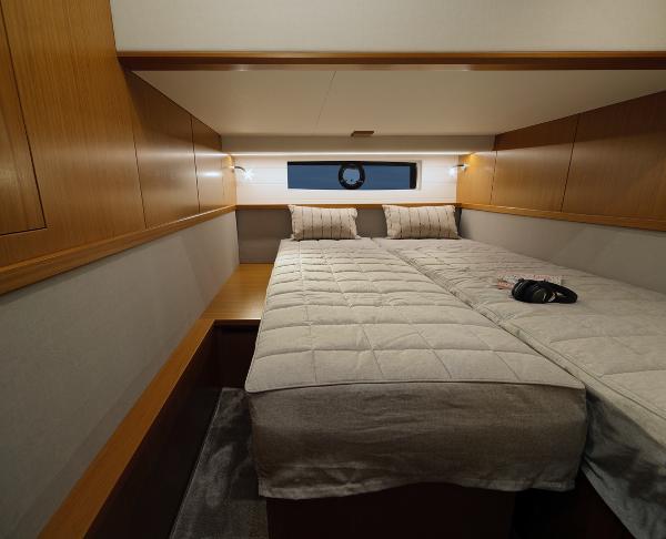 Slide: The Image of 2025 Sargo 45 Cat A cabin with double bed and wooden cabinetry. - 13
