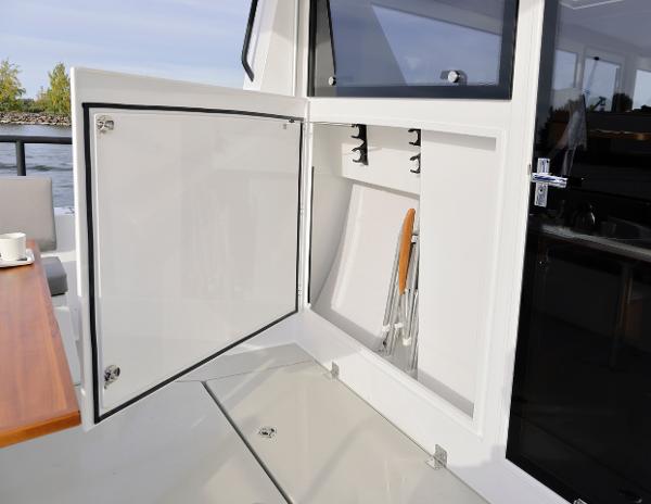 Slide: The Image of Open storage compartment on the 2025 Sargo 45 Cat A boat. - 8