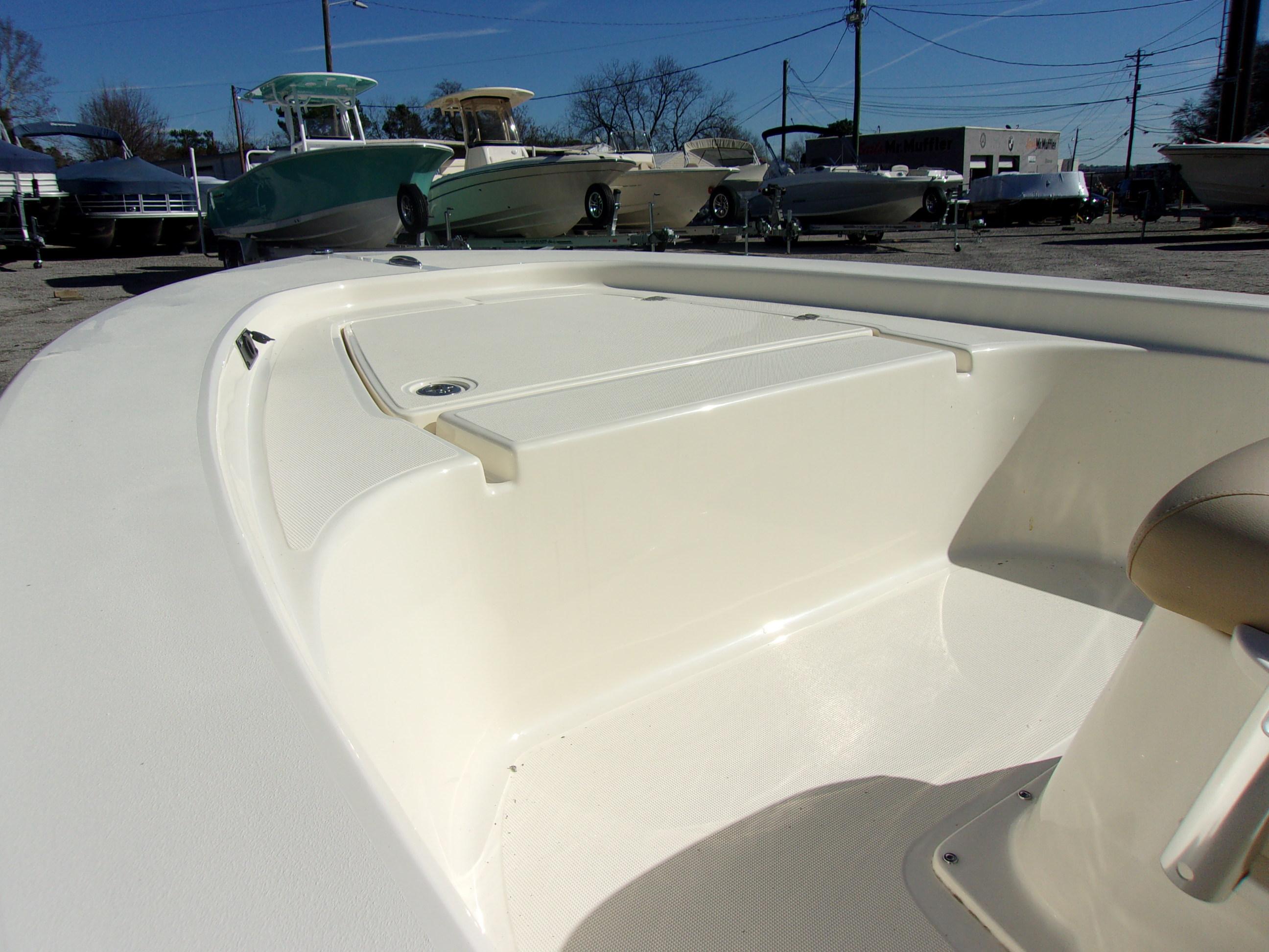 Slide: The Image of 2024 Scout 177 Sport boat interior with storage compartment. - 4