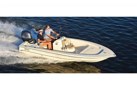 Slide: The Image of 2024 Scout 177 Sport boat cruising on open water with two passengers. - 6