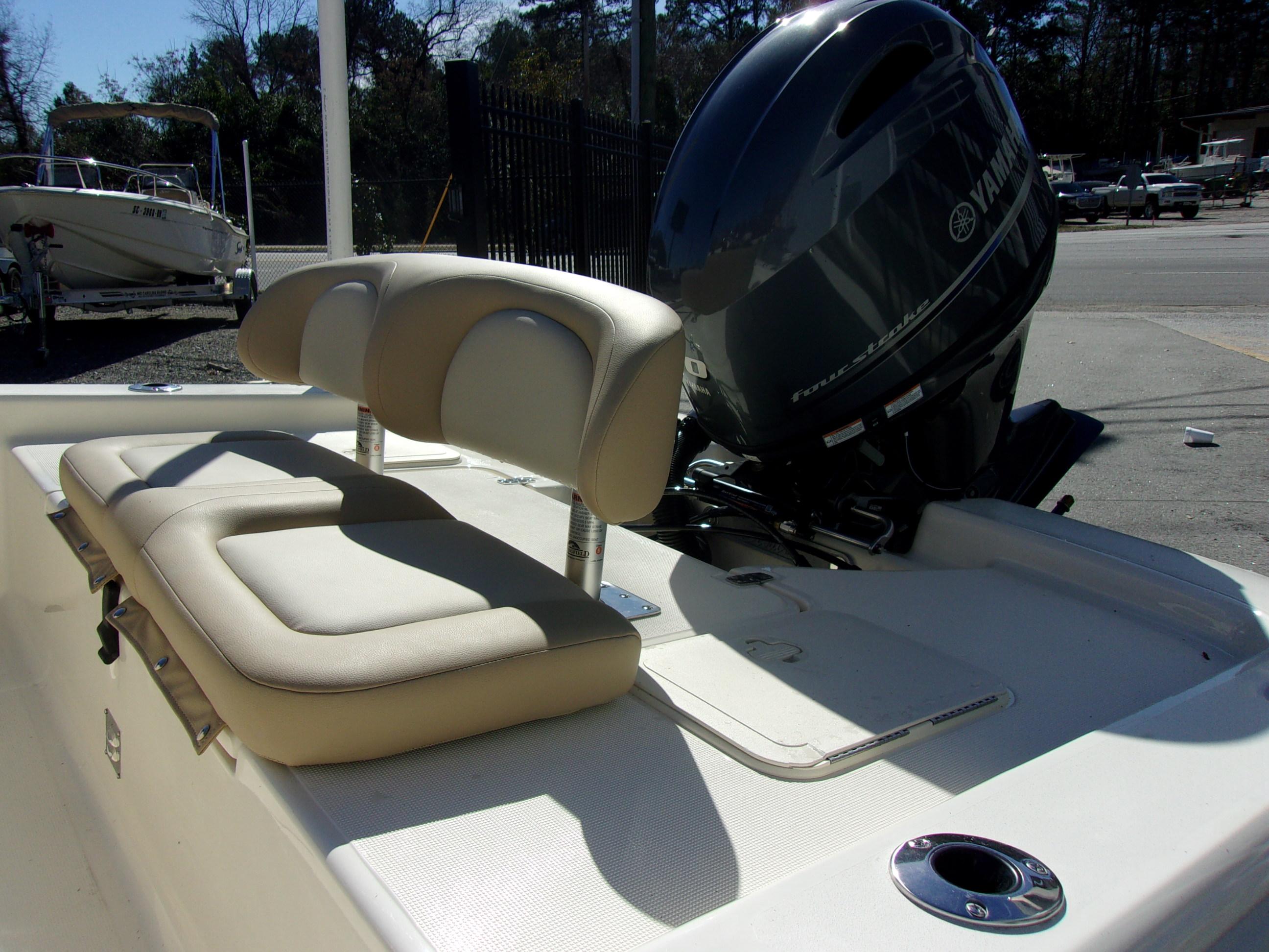 Slide: The Image of 2024 Scout 177 Sport boat with Yamaha four-stroke engine and beige seating. - 7