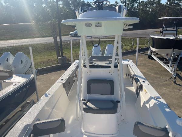 Slide: The Image of 2024 Sea Born LX 24 LE center console boat with seating and dual outboard engines. - 7