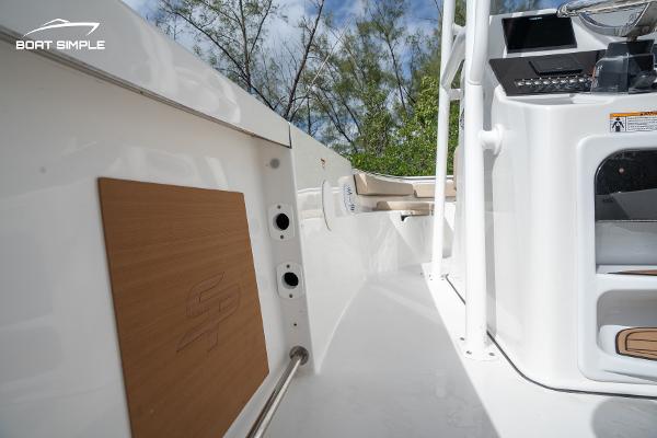 Slide: The Image of 2023 Sea Pro 219 Deep V CC boat interior with console and storage. - 7