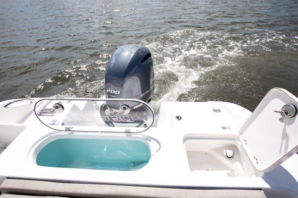 Slide: The Image of 2024 Sea Pro 222 Center Console boat with Yamaha 200 outboard motor on water. - 10