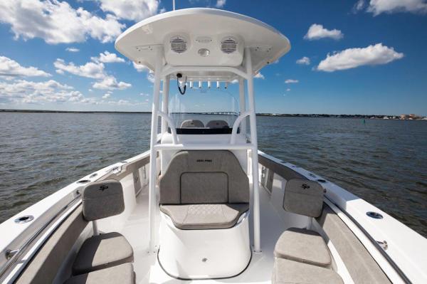 Slide: The Image of 2024 Sea Pro 222 Center Console boat on open water under blue sky. - 3
