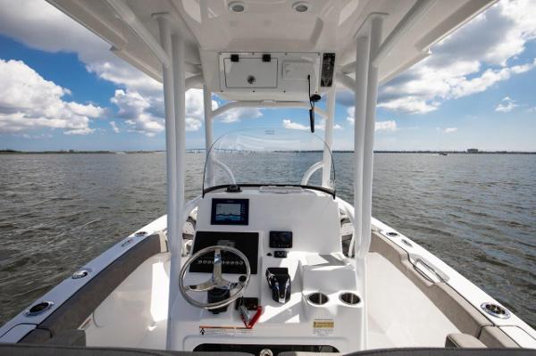 Slide: The Image of 2024 Sea Pro 222 Center Console boat interior with steering wheel and navigation system. - 5