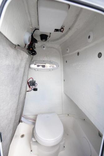 Slide: The Image of 2024 Sea Pro 222 Center Console boat interior with marine toilet. - 6