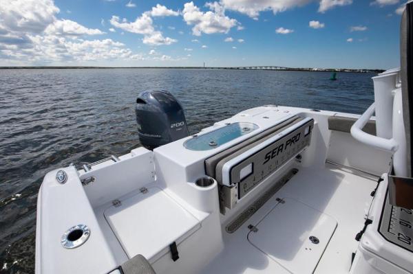 Slide: The Image of 2024 Sea Pro 222 Center Console boat on open water, featuring a powerful outboard motor. - 8