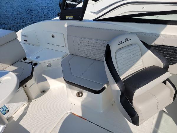 Slide: The Image of 2023 Sea Ray 230 SPX boat interior with seating and Mercury engine. - 4