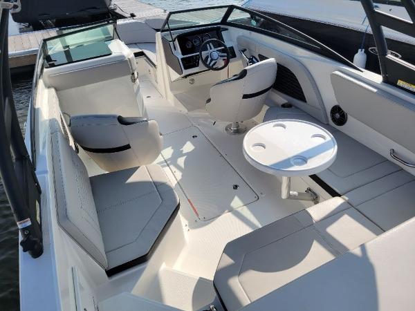 Slide: The Image of 2023 Sea Ray 230 SPX boat interior with seating and table. - 6
