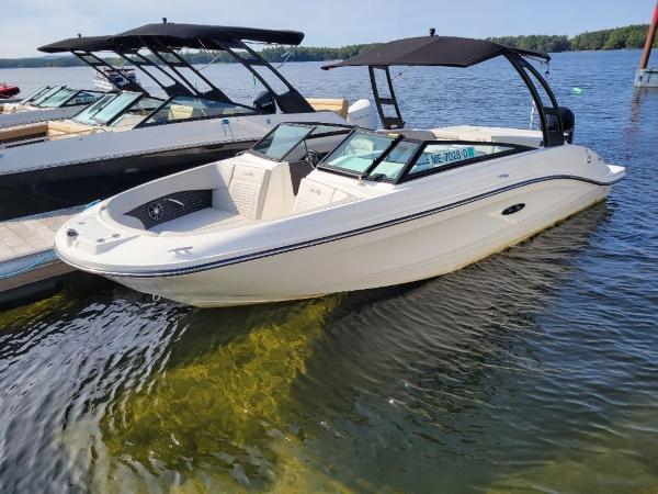 Slide: The Image of 2023 Sea Ray 230 SPX boat docked on a sunny day. - 7