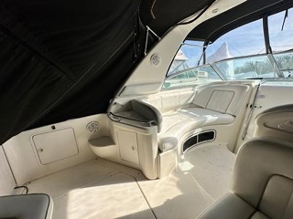 Slide: The Image of 1998 Sea Ray 290 Sundancer boat interior with seating and storage compartments. - 13