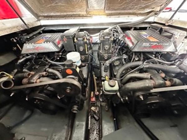 Slide: The Image of 1998 Sea Ray 290 Sundancer engine compartment with twin engines. - 22