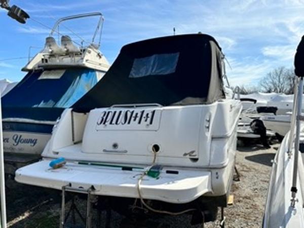 Slide: The Image of 1998 Sea Ray 290 Sundancer boat in storage, rear view. - 6
