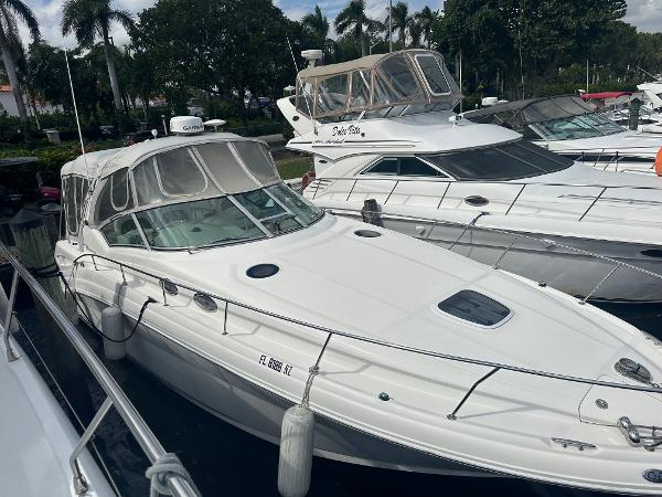Slide: The Image of 2006 Sea Ray 340 Sundancer yacht docked at marina with other boats. - 8