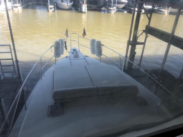 Slide: The Image of 1983 Sea Ray 390 Sport Fisherman docked at a marina. - 13