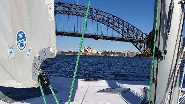 Slide: The Image of 2024 Seawind 1160 Lite sailing near Sydney Harbour Bridge and Opera House. - 16
